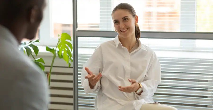 An admissions specialist explaining insurance coverage
